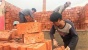Gaji Nunggak, Buruh di China Dibayar dengan Batu Bata