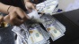 Perang Dagang AS -Cina Akibatkan Melemahnya Rupiah dekati Rp 15.000    