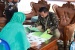 Asisten I Pemkab Karimun Serahkan Sertifikat  PTSL di Parit Benut